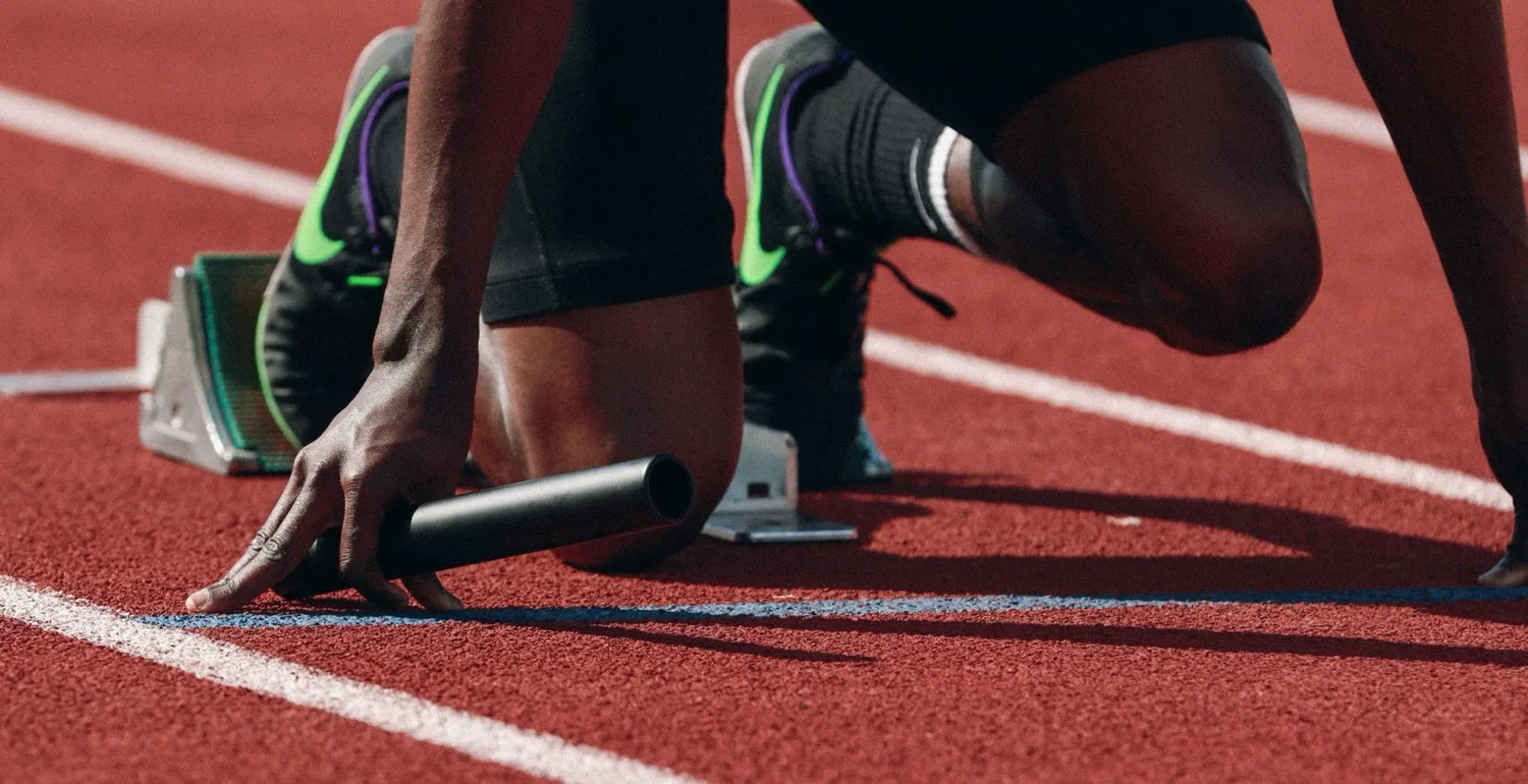 Athlete in starting blocks in a public figure protection client story