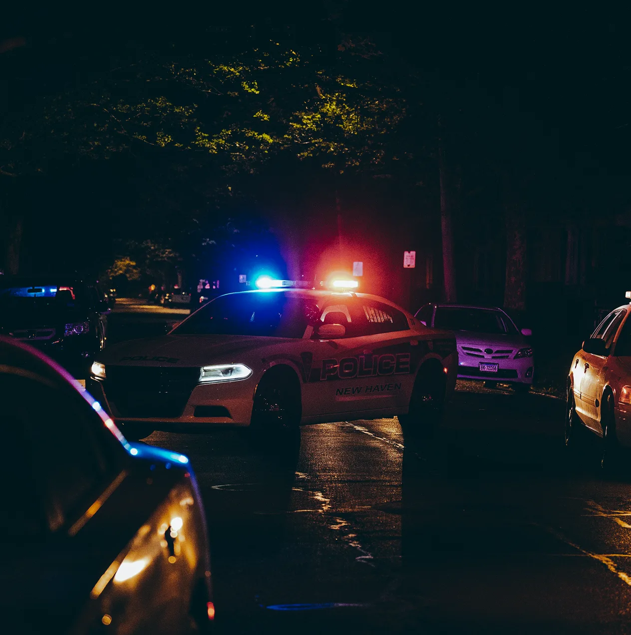 Patrol car emergency lights at night, OSINT for law enforcement investigations