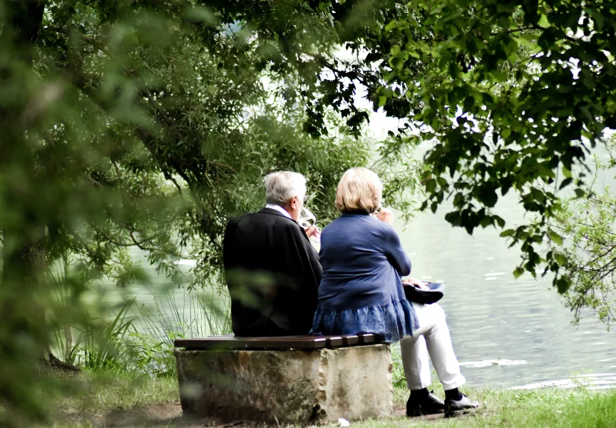 Older couple on a bench, protected against identity theft and fraud