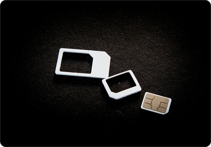SIM cards on a dark surface, illustrating SIM swap protection